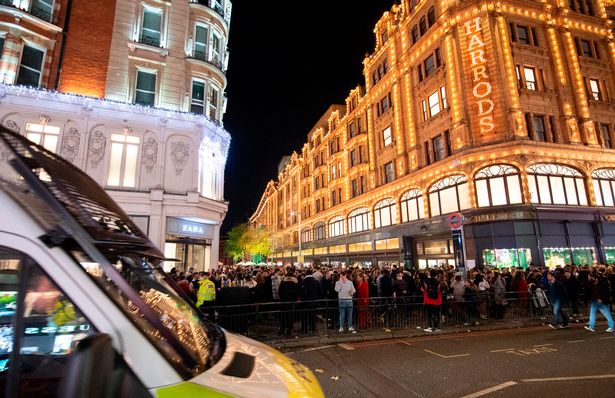  A large crowd of young people has built up outside Harrods Knightsbridge London Great Britain 5t 1
